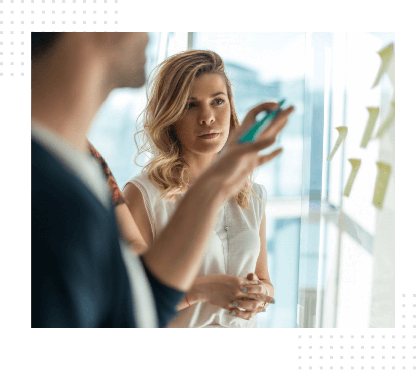 Dedicated team working on a project and looking at a computer screen